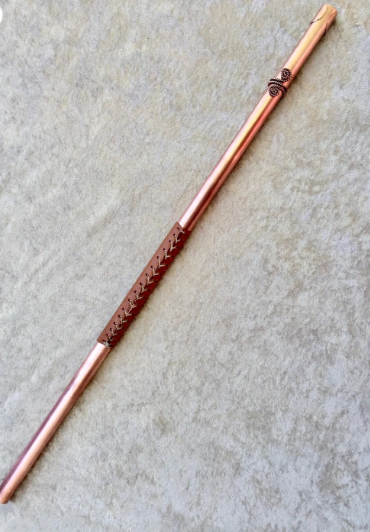Decorative copper rod on a textured surface