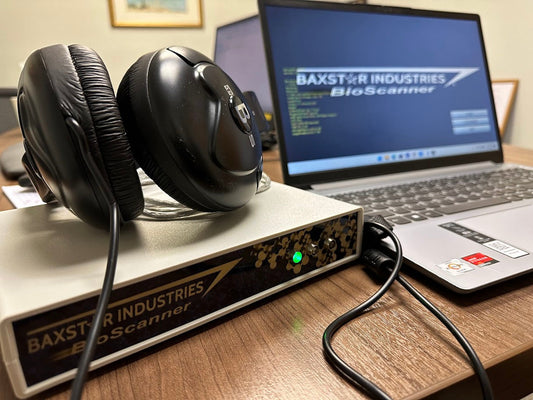 Bioscanner device with headphones connected to a laptop for wellness frequency scanning