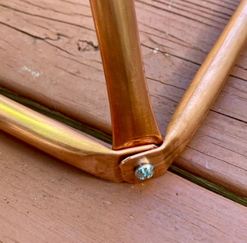 Close up of the corner screw on copper wire for golden ratio pyramid